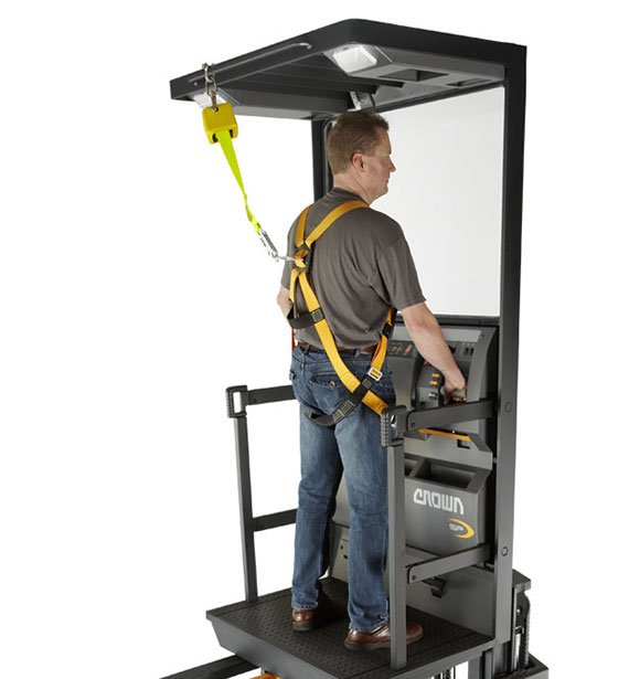 lift truck operator wears safety harness on Crown stockpicker 